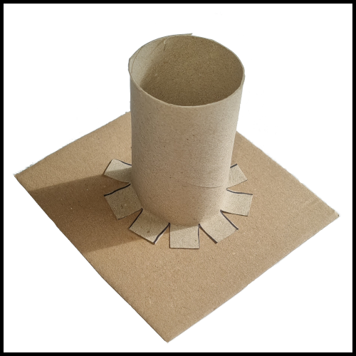 Paste the toilet paper roll on the cardboard