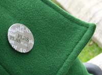 lapela de abrigo verde