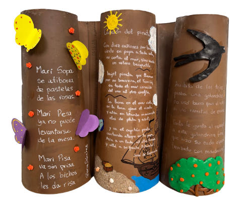 Tejado tejas (cREAgal) Tejas decoradas con soles y mariposas y con poemas escritos sobre ellas