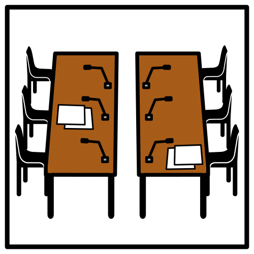 Pictograma que representa un espazo organizado para celebrar unha reunión