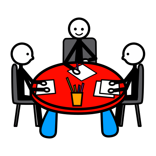 Tres individuos sentados en una mesa redonda trabajando en grupo