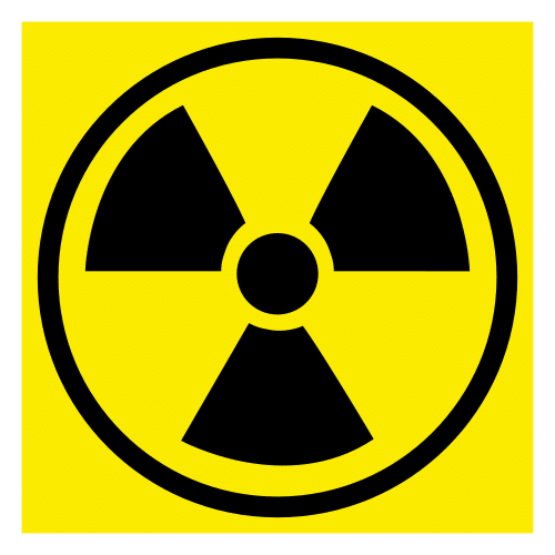 Fondo amarelo co símbolo da radiación, trevo radioactivo, en cor negra.